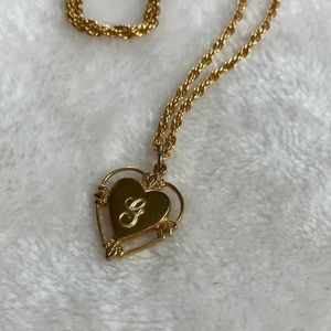 Gold tone chain with dainty heart pendant with initial G in pretty script.